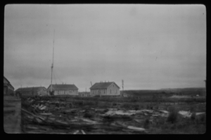Image: Several small buildings. Radio antenna